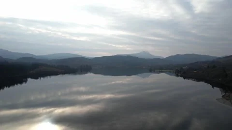 Reflections on a loch Vídeos de archivo 336713601