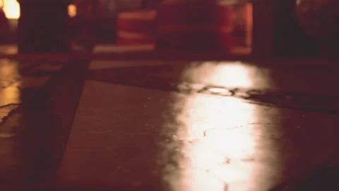 Reflections on a Mosaic Floor With Warm Lighting in a Cozy Interior Stock Footage 344901704