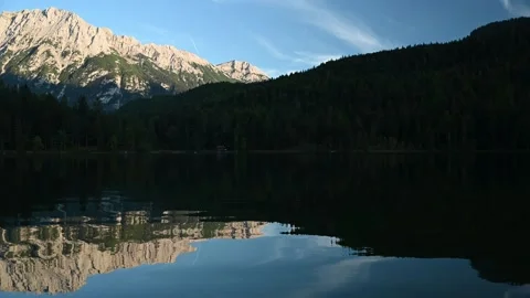 Reflections on a mountain lake in the evening Video stock 260868508