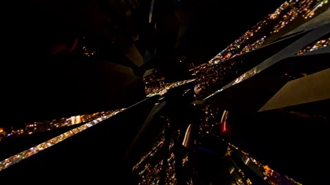 Reflections of a nighttime city skyline seen through fractal animated mirrors Stock Footage 241777094