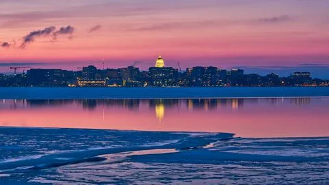 Reflections in an open patch on a mostly frozen Lake Monona, Madison, WI Stock Photos