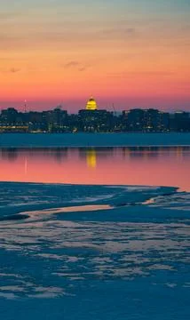 Reflections in an open patch on a mostly frozen Lake Monona, Madison, WI Stock Photos