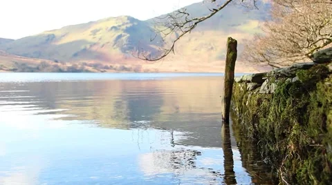 Reflections over beautiful water with stone pier - English Countryside Stock-Footage 40751000