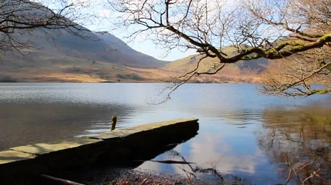 Reflections over beautiful water with stone pier - English Countryside Stock-Footage 40751005