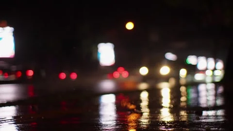 Reflections Over Wet Road On A Rainy Traffic At Night. Defocused Shot Stock Footage 274556439