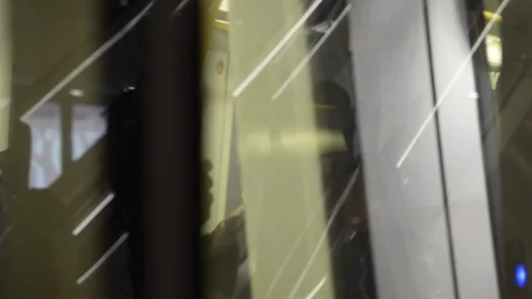 Reflections of people on an escalator Stock Footage 103697239