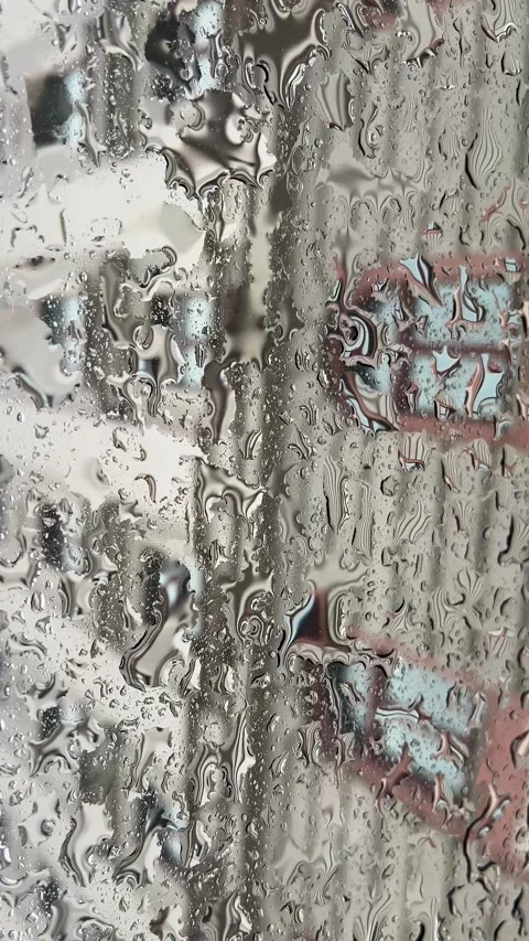 Reflections on Rainy Days and the Surfaces of Urban Environments and Their Stock Footage 308395290