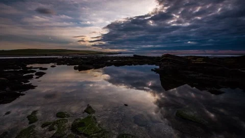 Reflections in a rock pool in marwick  Stock-Footage 256084112