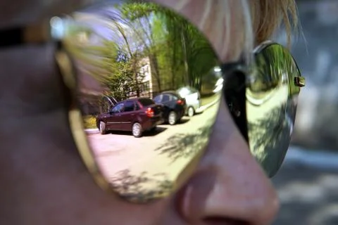 Reflections in rose mirror sunglasses close up Stock Photos