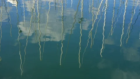 Reflections of sailboat masts Stock Footage 107652828