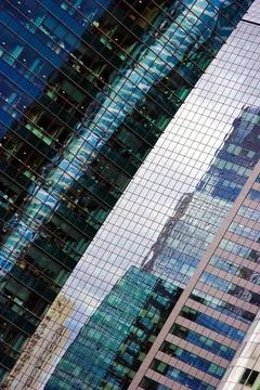 Reflections on skyscraper s windows Reflections on skyscraper s windows Co... Stock Photos