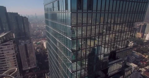 Reflections In Skyscraper Windows in Bangkok Office Block, Aerial Drone Shot Stock Footage 73311219
