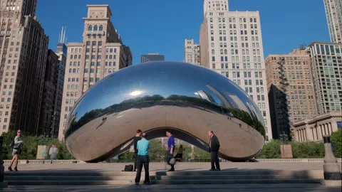 Reflections in Steel: Cloud Gate and Urban Skyline Stock Footage 317697069