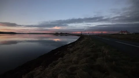 Reflections in the stenness loch looking over to the watch stone in Orkney Stock Footage 297768354