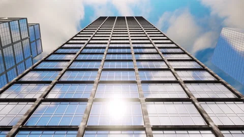 Reflections from the sun, clouds and sky on the glass windows of a skyscraper. Stock Footage 153844612