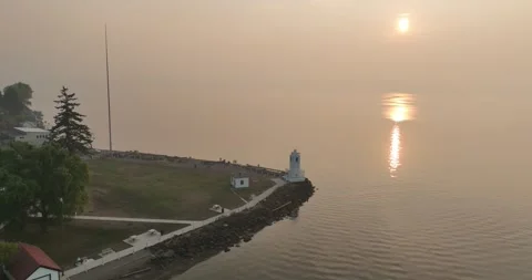 Reflections of the Sun Near a Lighthouse Drone Aerial View Tacoma Washington Stock-Footage 335741606