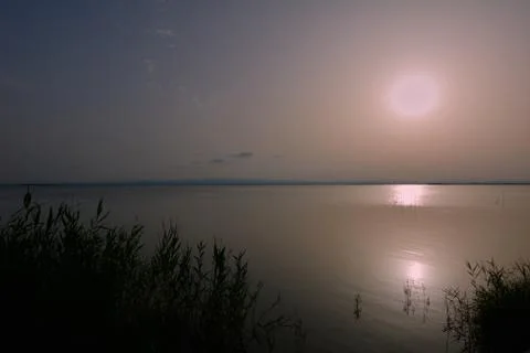 Reflections of the sunset in the lagoon Stock Photos