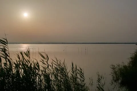 Reflections of the sunset in the lagoon Stock Photos