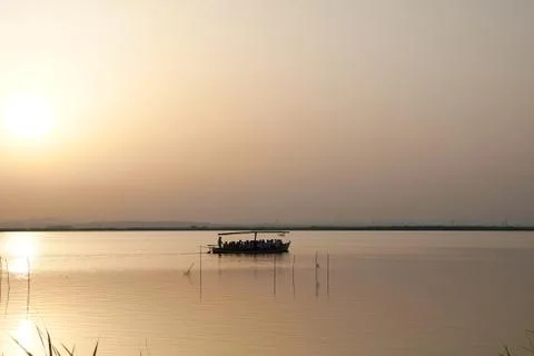 Reflections of the sunset in the lagoon Stock Photos