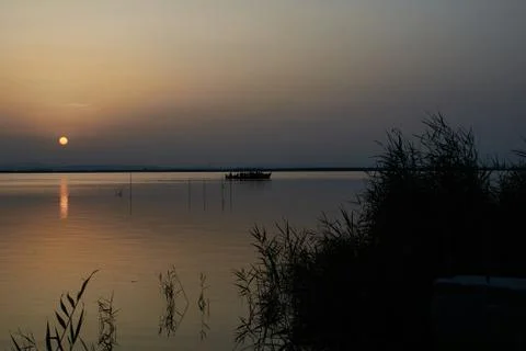Reflections of the sunset in the lagoon Stock Photos