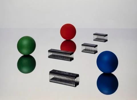 Reflections of three balls with three microchips, on white background Stock Photos