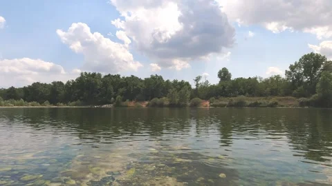 Reflections on the Ticino river from the bank Stock Footage 280276578
