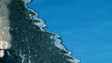 Reflections of a wall broken by waves 스톡 동영상 123295339