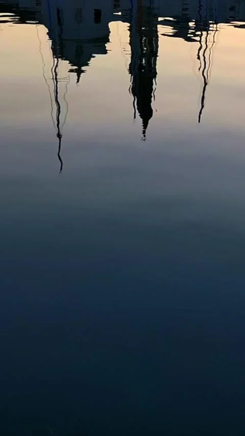 Reflections in the water of the masts of yachts moored in a picturesque mar.. Stock Footage 276427399