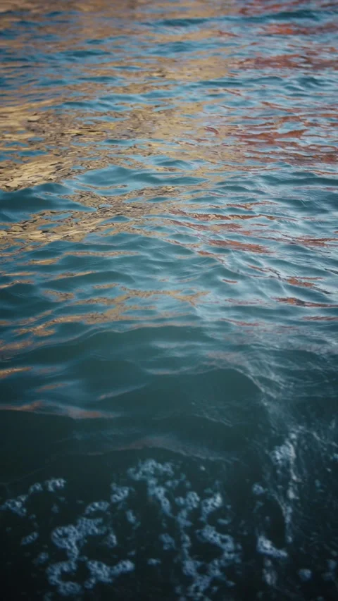 Reflections on water surface during sunset in Venice, Italy. Slow motion. Stock Footage 291067892