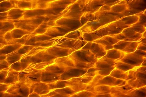Reflections on the water surface in the river. Background of corrugated pat.. Stock Photos