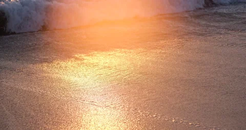Reflections on wet sand on beach at sunset Stock Footage 168651684