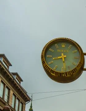 Reflections in a window of a watchmakers symbol Stock Photos
