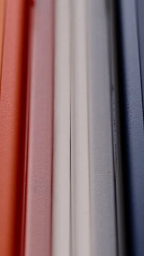 Reflective Apple Logo on Cosmic Orange iPhone 17 Pro Next to Other Device Edges Stock Footage 318056573