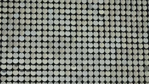 Reflective circular pattern. Metallic, reflective, circular discs, sequins or Stock Footage 311372929