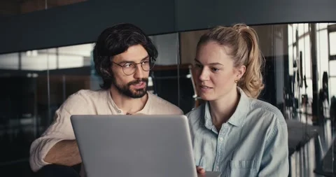 Reflective Collaboration: Dynamic Duo in the Glass-Walled Office Видео 242900556