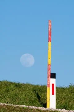 Reflective edge marker post and snow pole on the side of the road Stock Photos