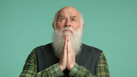 Reflective Elder Posing with Prayer Hands, Seeking Solace and Peace Stock Footage 264120098