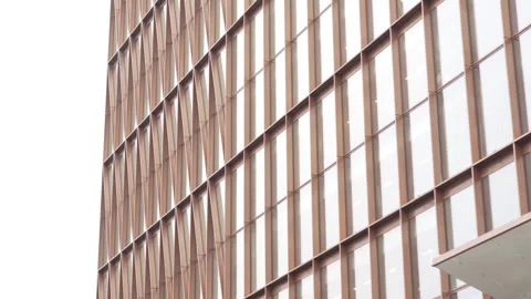 Reflective glass facade features protruding window frames Видео 316754117