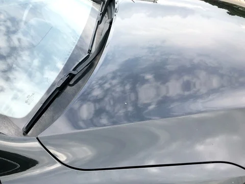 Reflective image of flying airplane on surface of car Stock Footage 79191056