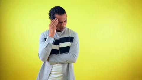 Reflective Man Stands Lost in Deep Thought Stock Footage 311622993