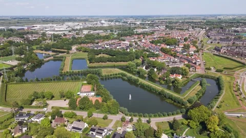 Reflective moats angular green fortification lines quiet residential blocks Stock Footage 327946310