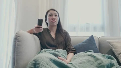 Reflective Moment at Home with Remote Control Stock Footage 314570591