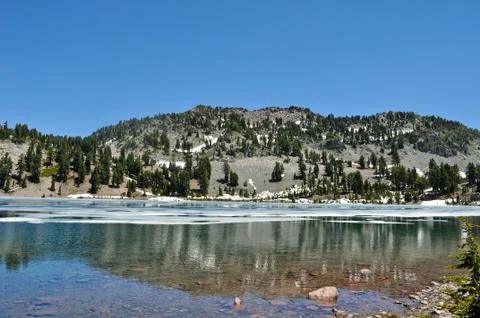 Reflective mountain lake Foto stock