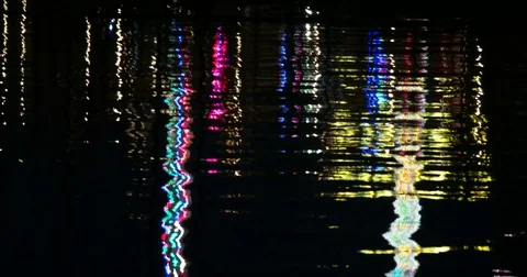 Reflective Night Lights on a Water Surface on the Kiel Week Festival in Germa Stock Footage 77102931