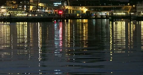 Reflective Night Lights on a Water Surface on the Kiel Week Festival in Germa Stock Footage 77103290