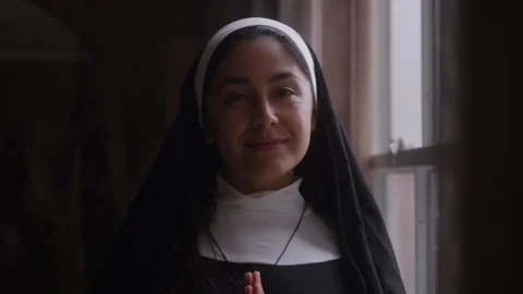 Reflective Nun Looks out Window in Prayer Turning  Face to You Видео 270399201