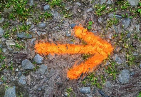 Reflective orange arrow Stock Photos
