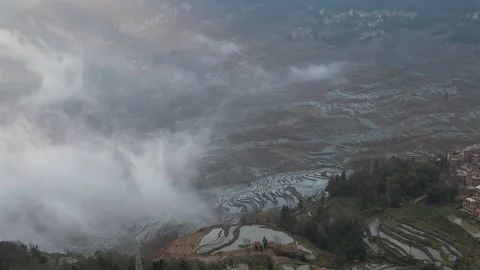 Reflective Rice Terraces Under Layered Clouds in Yuanyang, China Stock Footage 344038403