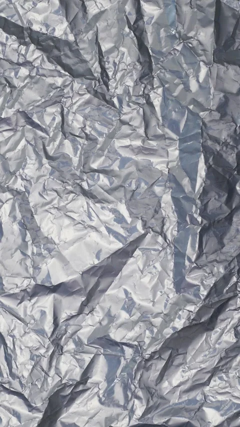 Reflective Silver Foil Background Texture with Crumpled Wrinkles and Light Stock Footage 311501647