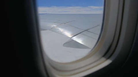 The reflective silver wings of the airplane s windows Stock Footage 125922630